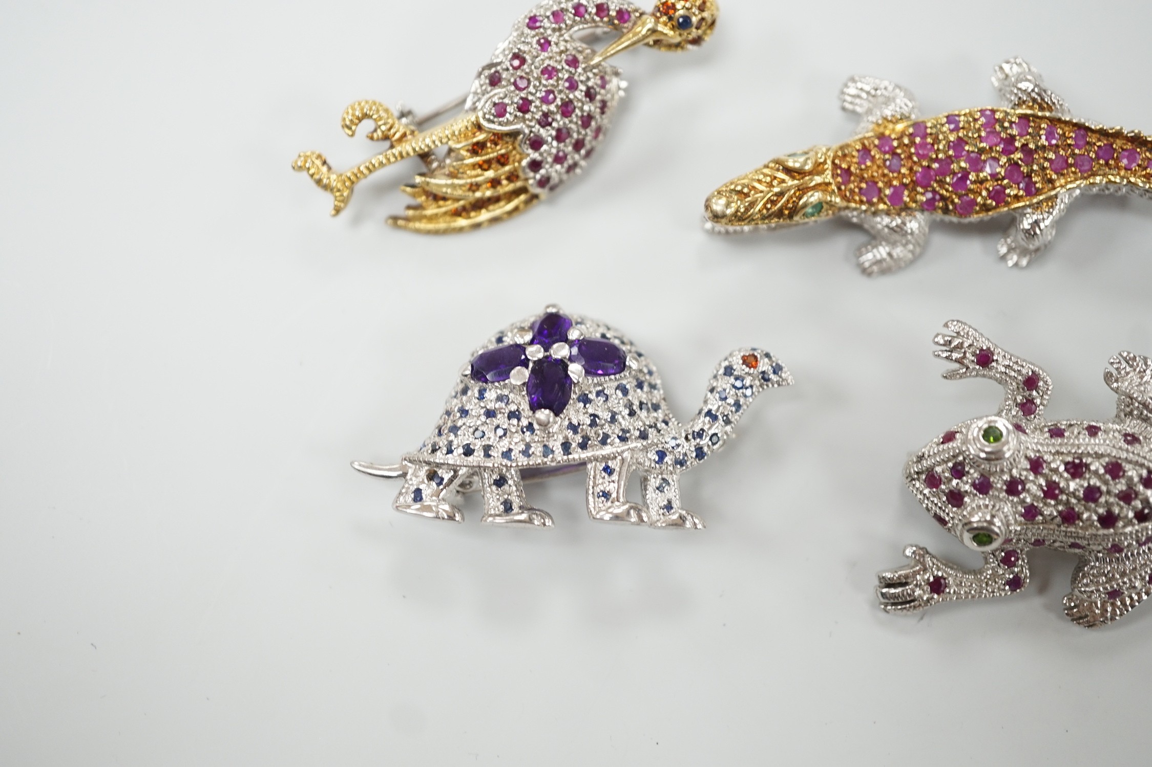 Four assorted modern white metal and coloured paste set miniature animal brooches, three stamped 925, including frog, crane, tortoise and crocodile.